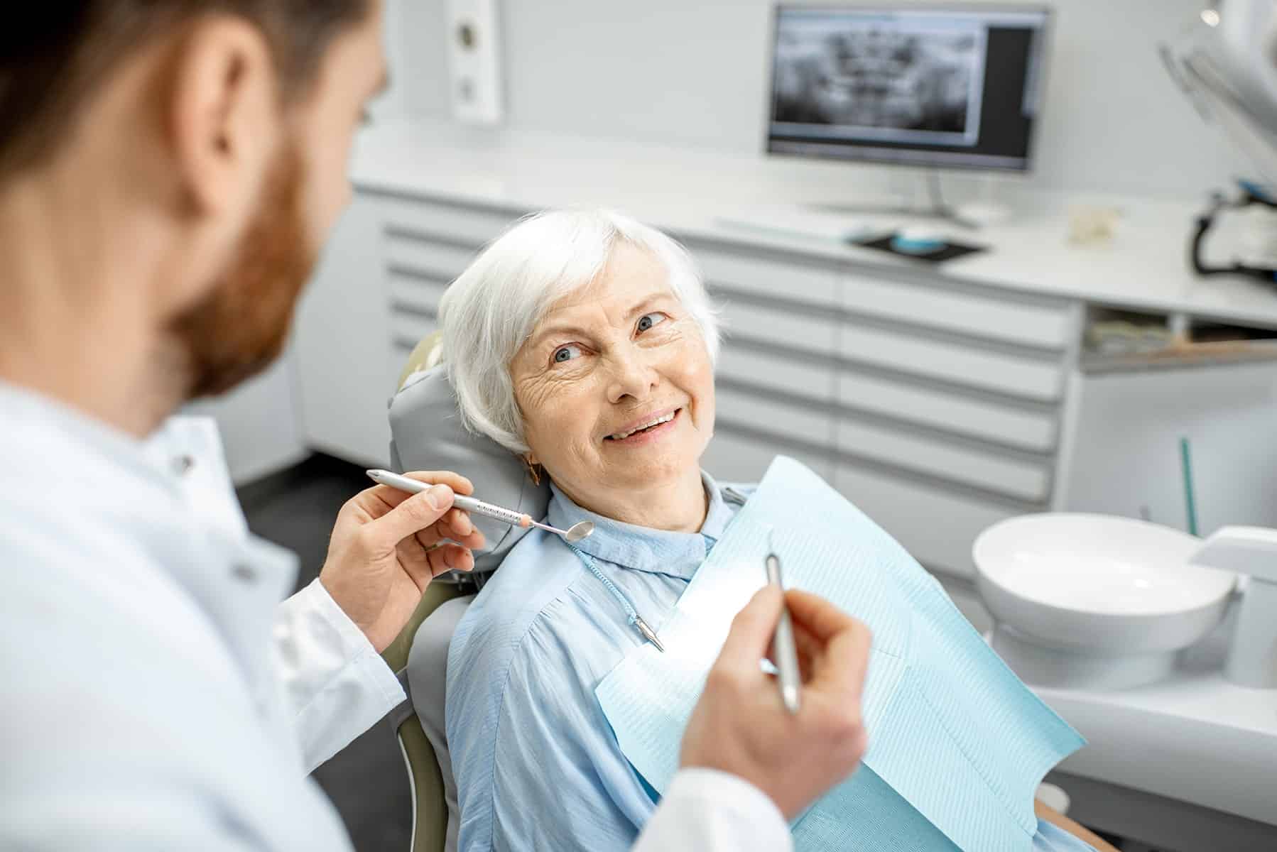 Woman getting dental implant treatment in Fort Wayne, IN